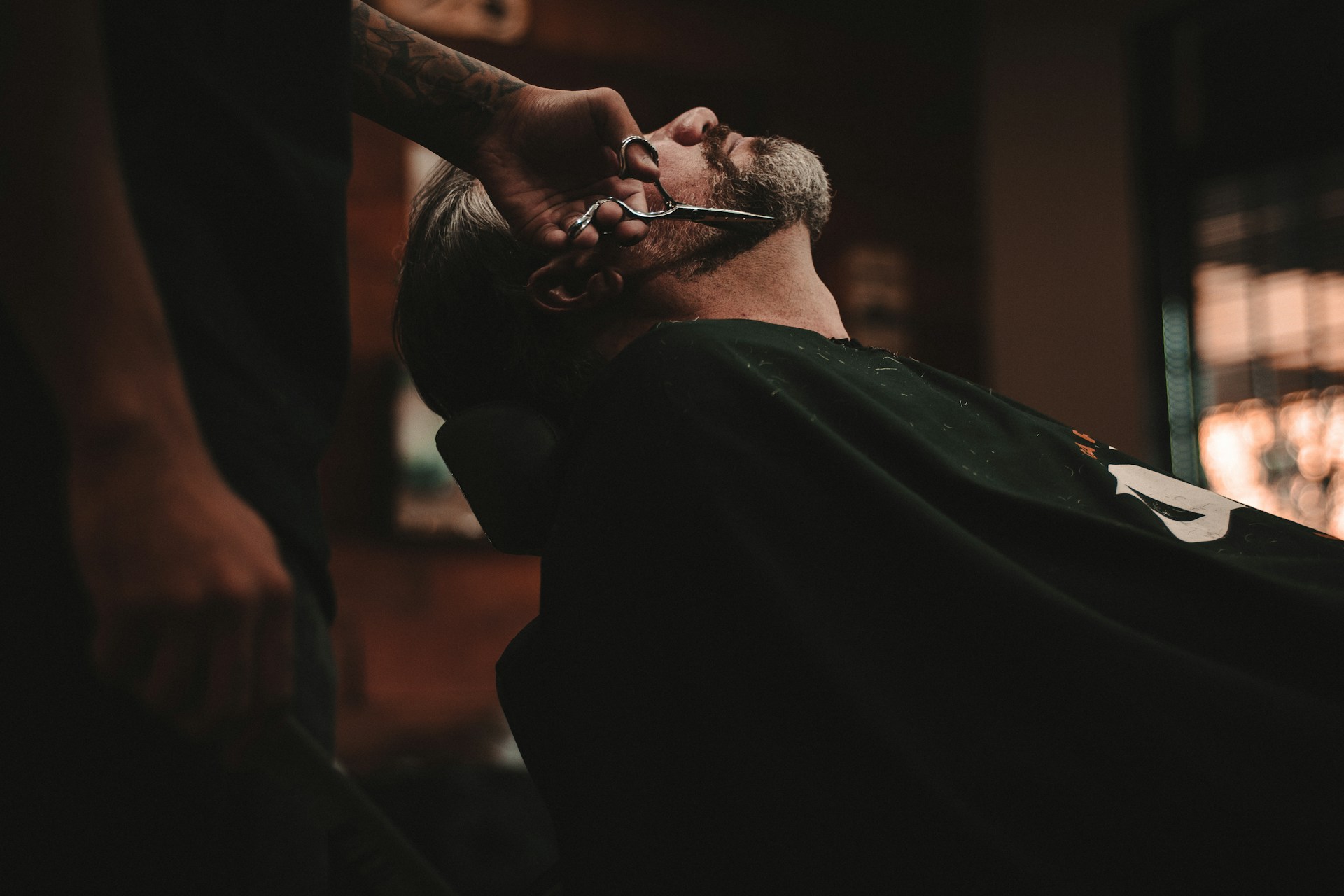 Man getting his beard trimmed